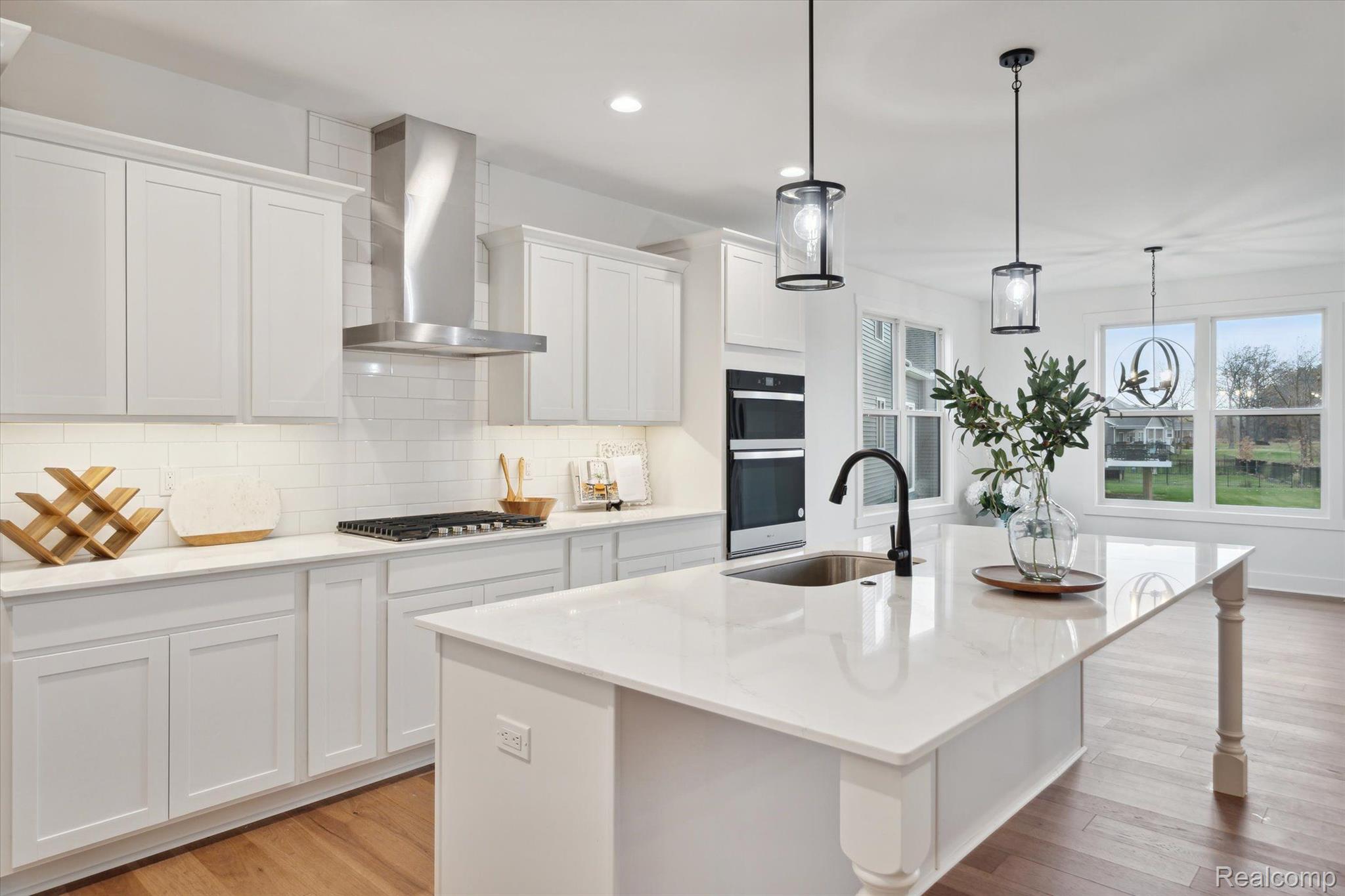 Kitchen with large island and white cabinetry