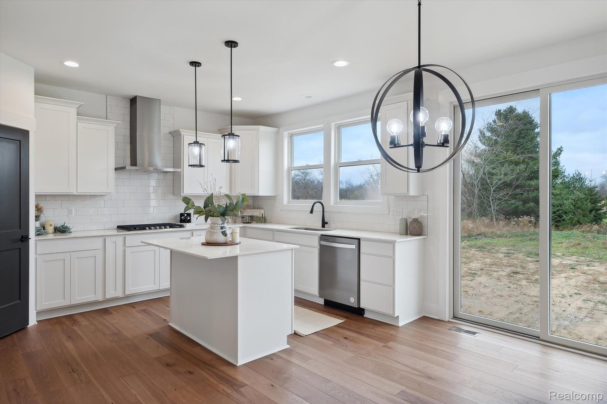 Kitchen with island and sliding glass doors to the yard