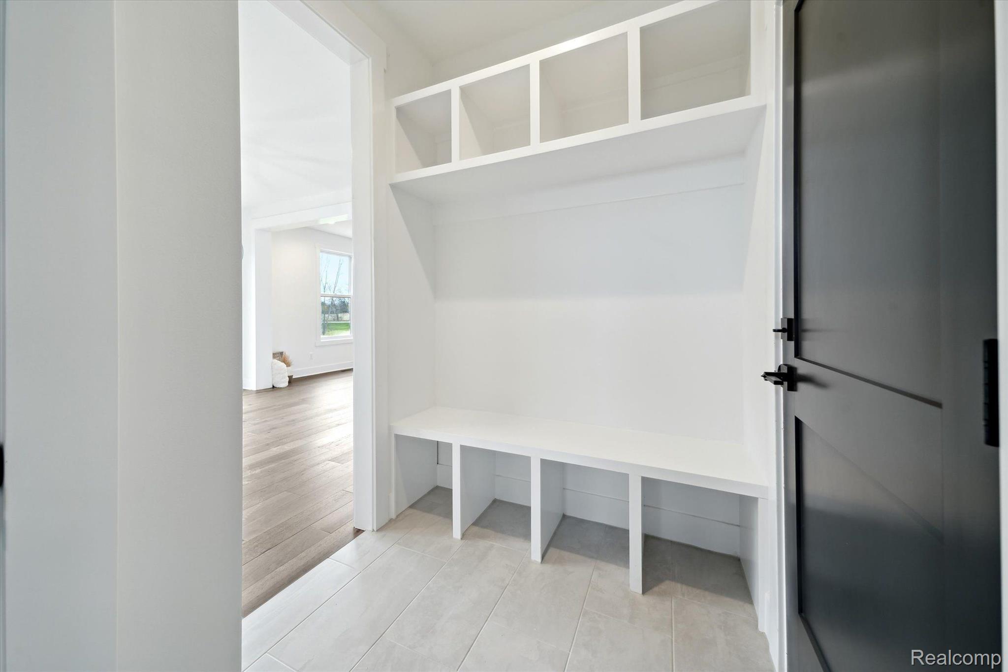 Mudroom with built-in bench and lockers